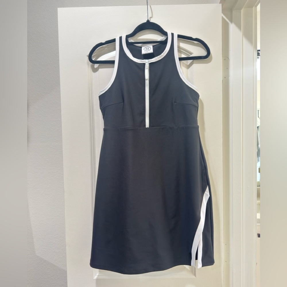 Black and white Athletic dress with built in athletic shorts for tennis or golf.